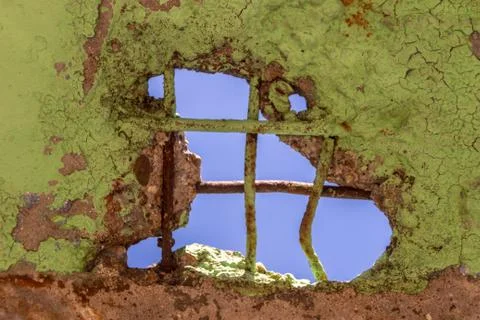 Hole in the ceiling through which the blue sky is visible Stock Photos