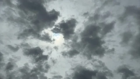 A Hole Of Clouds With Light On Murky Cloudy Sky With Silhouette Bird Flying Stock Footage 283750497