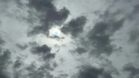 A Hole Of Clouds With Light On Murky Cloudy Sky With Silhouette Bird Flying Stock Footage 283750506