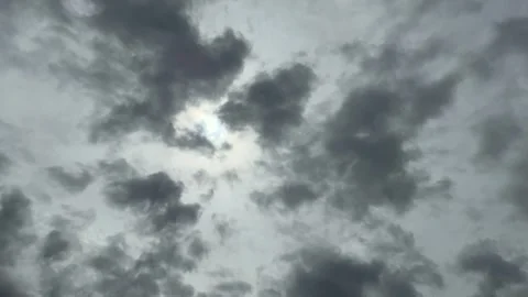 A Hole Of Clouds With Sunlight On Murky Cloudy Sky With Silhouette Birds Flying Stock Footage 283750524