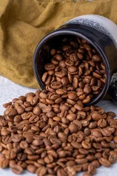 Hole coffee beans in a ceramic cup Stock Photos