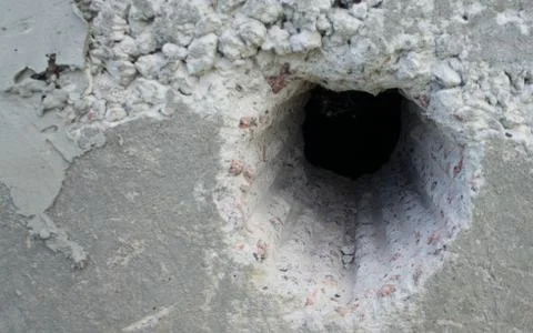 Hole in concrete Stock Photos