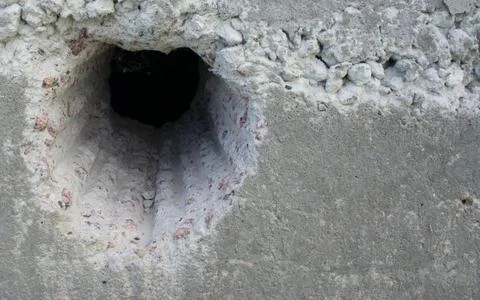 Hole in concrete Stock Photos