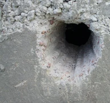 Hole in concrete Stock Photos