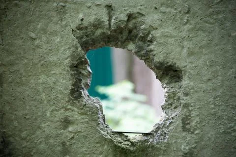 Hole in the concrete wall Stock Photos
