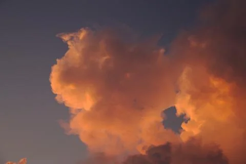 Hole in Dramatic Pink Clouds Stock Photos