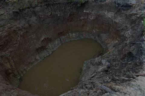 A hole dug in the forest Stock Photos