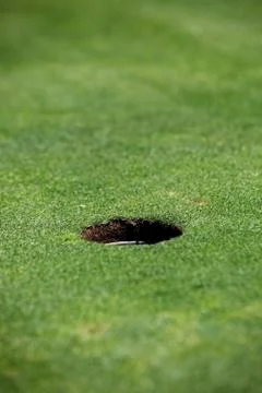 Hole on a golf course Stock Photos