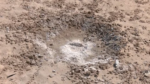 Hole in the ground from a powerful explosion 스톡 동영상 257290223