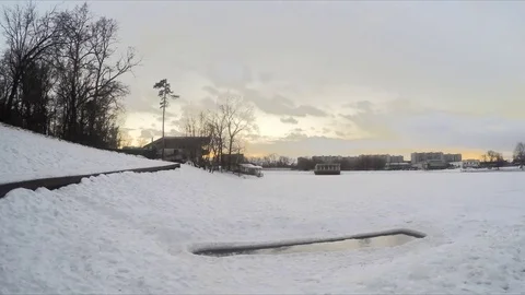 Hole in ice on the pond in winter timelapse Video stock 79815119
