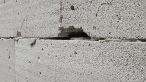 A hole in a light brick wall Stock Footage 336577467