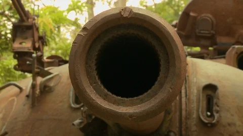 Hole of a muzzle brake at the Cambodia War Museum 스톡 동영상 115159343