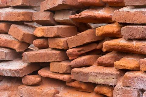 Hole in an old brick wall collapsing Stock Photos