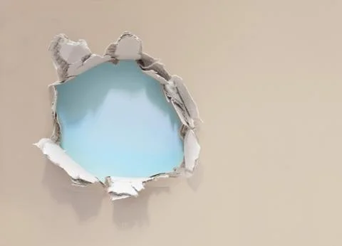 Hole in paper wall Stock Photos