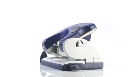Hole Punch - Office Tool rotating over isolated white Background Locher dreht Stock Footage 282381930