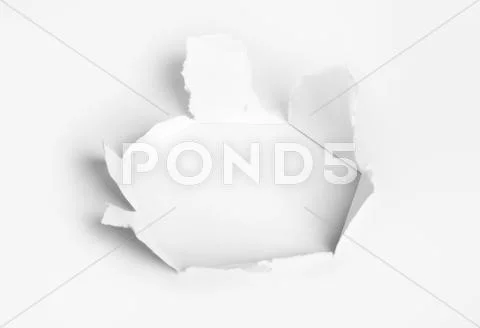 Hole punched in the paper Stock Photos