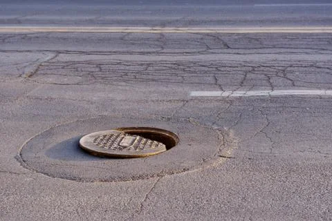 Hole in the road. Stock Photos