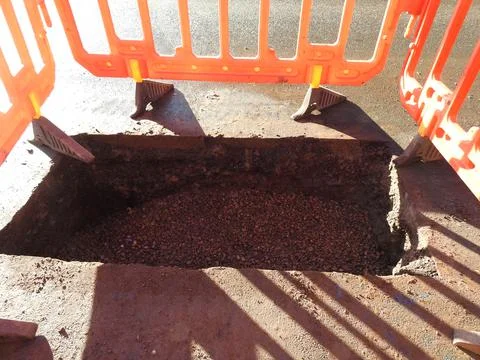 Hole in the road Stock Photos