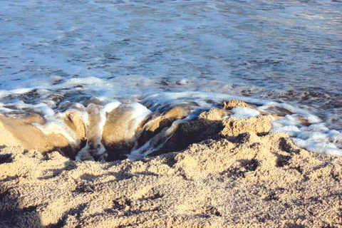 Hole in the sand Foto stock