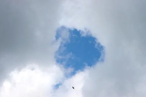 Hole sky in the clouds. Stock Photos