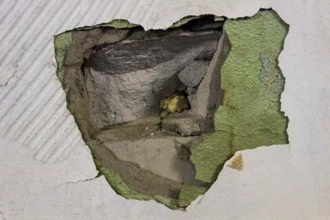 Hole in the wall from the bullet Foto stock