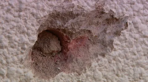 Hole in wall close up Stock Footage 11986939