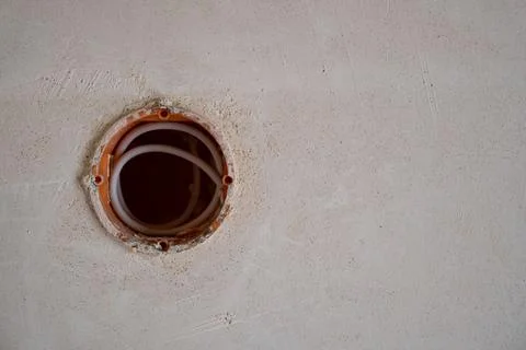 Hole in wall for electricity socket Stock Photos