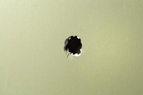 Hole wall green background Stock Photos
