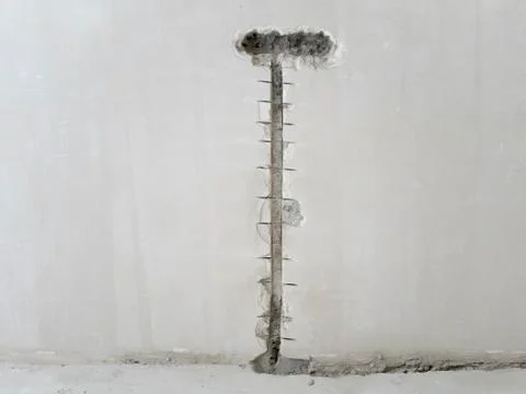 Hole in the wall under the socket Stock Photos
