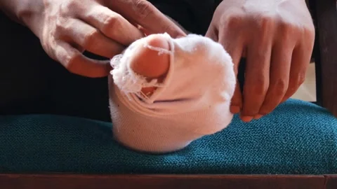 Hole in worn out sock Stock Footage 336706950