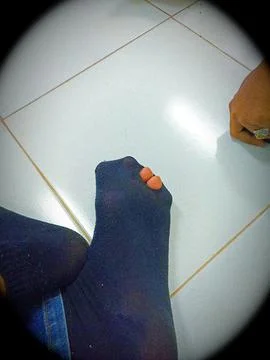 Holed sock Stock Photos