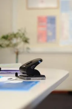 Holepunch in office Stock Photos
