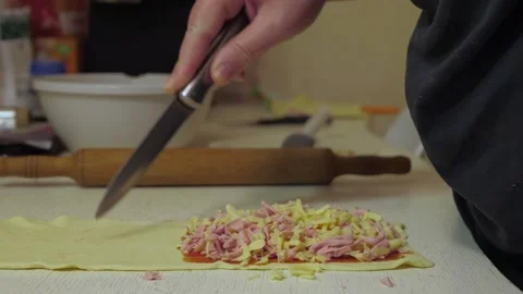 Holes are cut into the rolled dough Vidéo 342361685