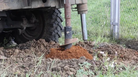 Holes boring in ground with drilling rig machine Stock Footage 88468252