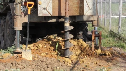 Holes boring in ground with drilling rig machine Stock Footage 89338063