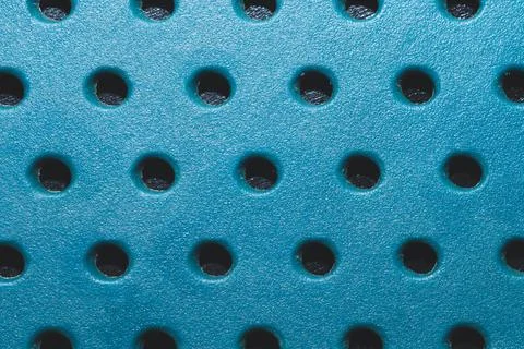 Holes in plastic plate. abstract pattern background Stock Photos