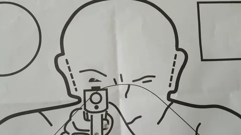 Holes on template used for shooting exercise with 9 gauge pistol Video stock 124385204
