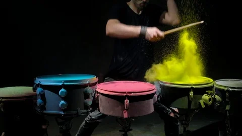Holi powder bounces off the drum in the form of a shock wave, Close up. Black Stock Footage