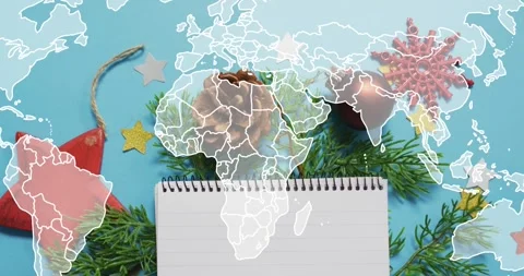Holiday arrangement on blue surface while world map outline fading tracing Stock Footage 317835574
