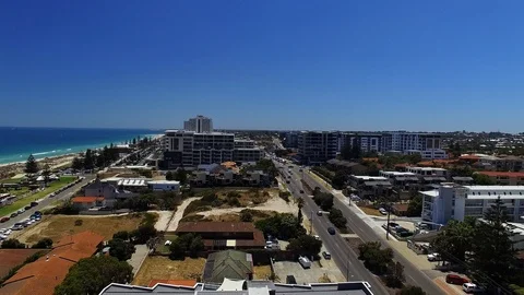Holiday beach side resort summertime tracking aerial footage Stock Footage 101427579