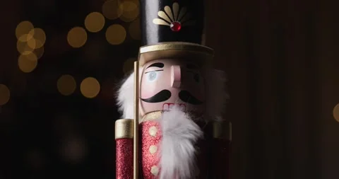 Holiday charm brought to life, Nutcracker figurine spin gracefully against a Stock Footage 287176947