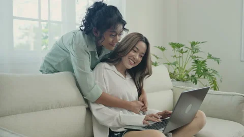 Holiday concept of 4k Resolution. Asian women playing laptops together in the Stock Footage 192566517