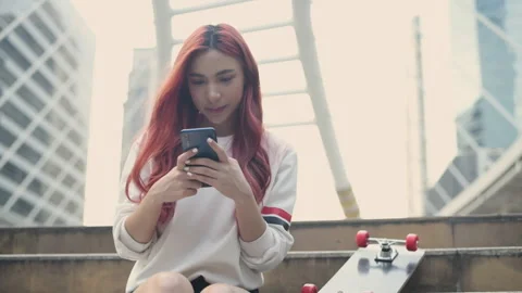 Holiday concept of 4k Resolution. Asian woman playing mobile phone in the cit Stock Footage 266739039