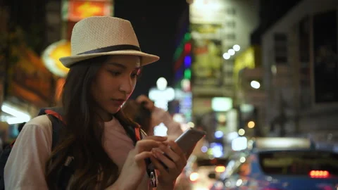 Holiday concept of 4k Resolution. Asian woman using mobile phone in city at.. Stock Footage 314909893