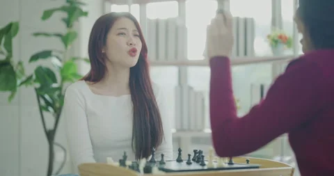 Holiday concept of 4k Resolution. Asian women playing chess together in the.. Stock-Footage 332679544