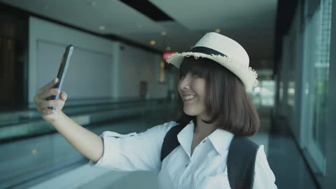 Holiday concept of 4k Resolution. Asian woman taking a selfie inside the te.. Stock Footage 334969883