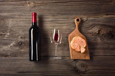 Holiday Dinner setting with red wine and creaming cheese on rustic wood. Top  Stock Photos