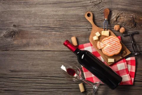 Holiday Dinner setting with red wine and creaming cheese on rustic wood. Top  Stock Photos