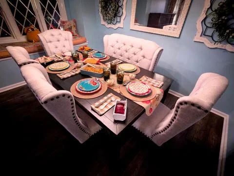 Holiday Dinner Table Setup in Cozy Home Dining Room Stock Photos