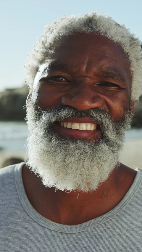 Holiday, face or black man at beach with smile, positive attitude or upbeat on Stock Footage 340614947